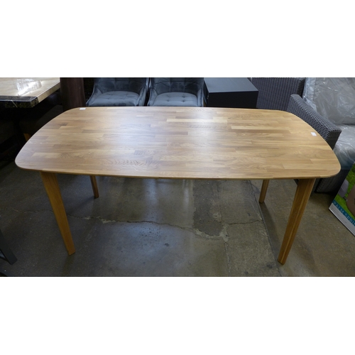 1471 - An oak fixed top oval dining table