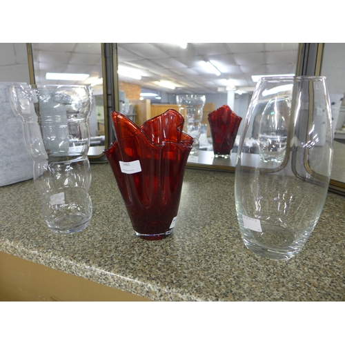 1480 - A ruby red tulip vase, a clear bubble vase and one other