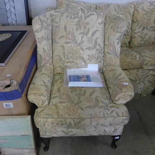 1548 - A Multiyork cream floral upholstered three seater sofa and a pair of matching armchairs