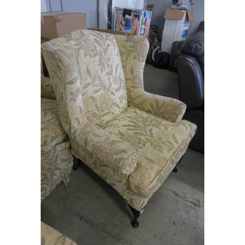 1548 - A Multiyork cream floral upholstered three seater sofa and a pair of matching armchairs