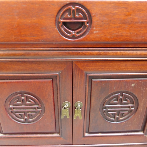 1557 - An oriental mahogany two door, single drawer cabinet