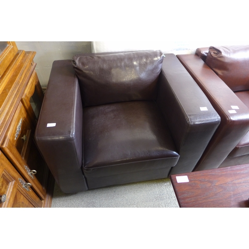 1590 - A dark brown leather effect armchair