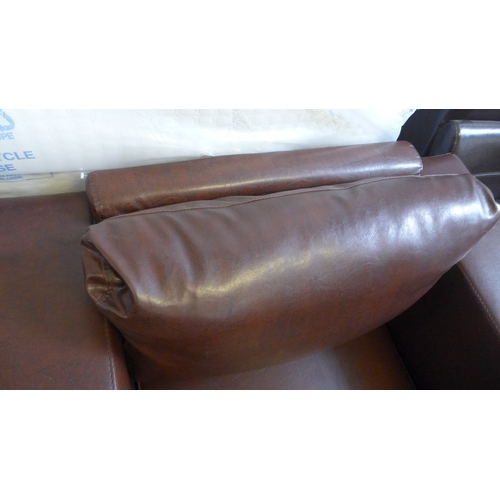 1591 - A brown leather effect armchair