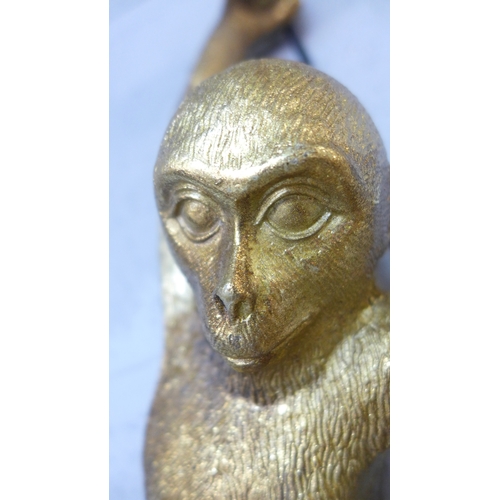 1414 - A wall light in the form of a hanging monkey