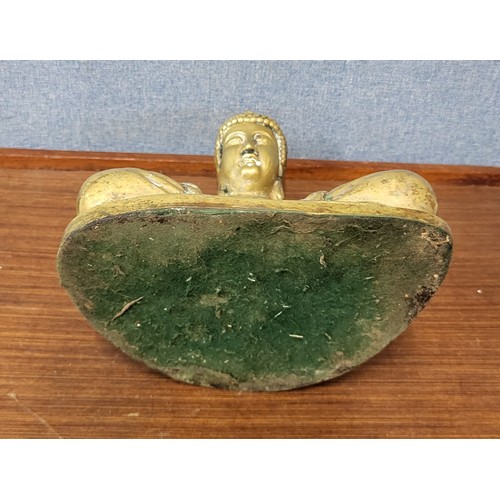 393 - A brass figure of seated Buddha, 26cms h