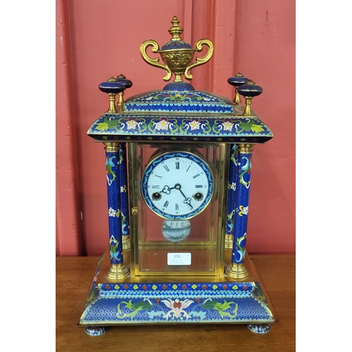 395 - A French style gilt metal and blue champleve enamelled desk clock