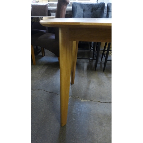 1318 - An oak fixed top dining table