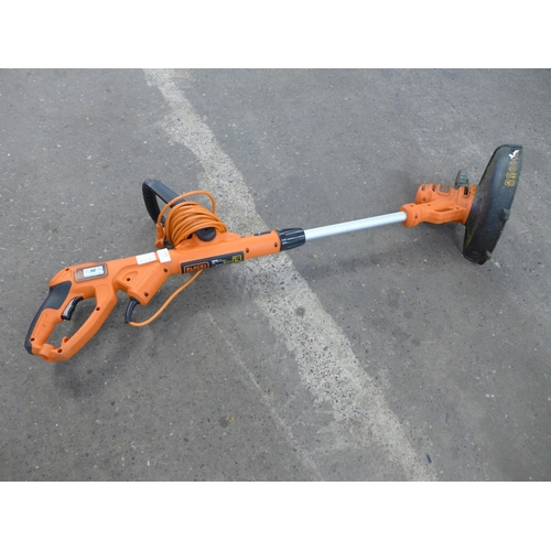 A Black & Decker electric strimmer with lawn mower attachment