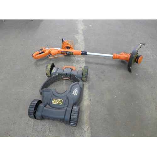 A Black & Decker electric strimmer with lawn mower attachment