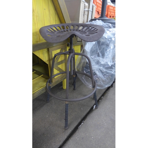 A tractor seat bar stool This lot is subject to VAT
