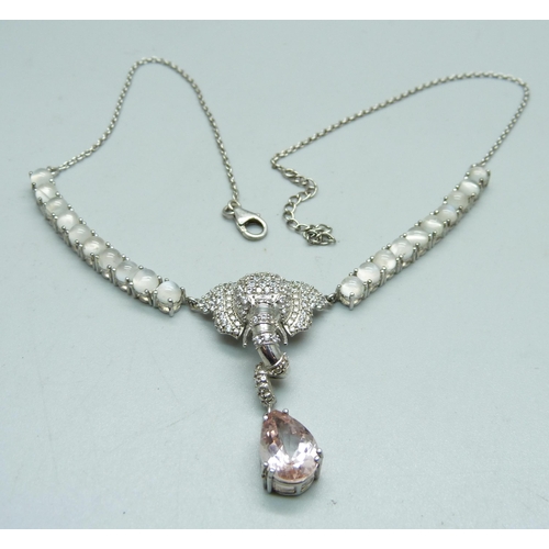 1022 - A silver gem set elephant necklace