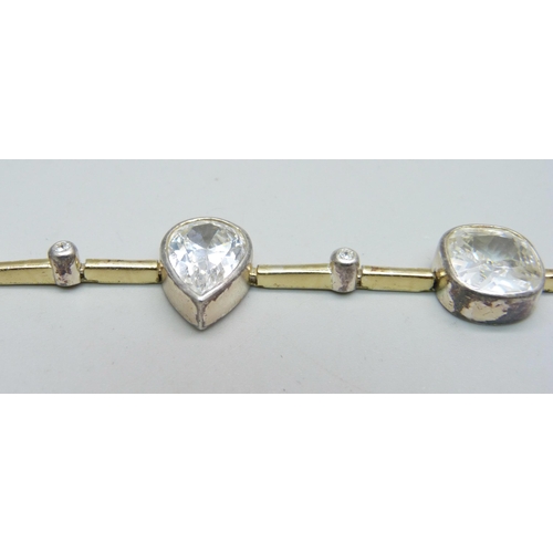 1023 - A silver gem set bracelet, 27.9g