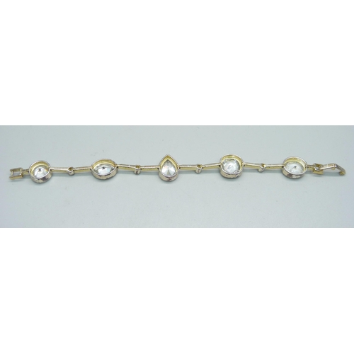 1023 - A silver gem set bracelet, 27.9g