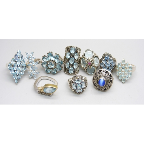 1032 - Ten silver 'chunky' rings, all set with blue stones