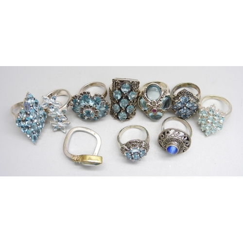 1032 - Ten silver 'chunky' rings, all set with blue stones