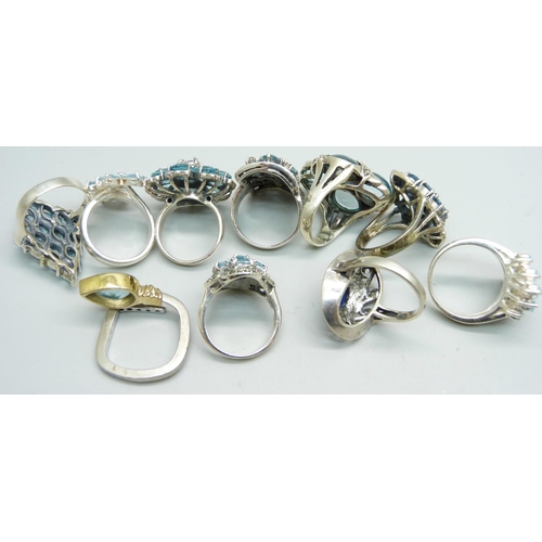 1032 - Ten silver 'chunky' rings, all set with blue stones