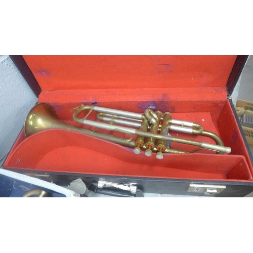 1069 - Two trumpets, cased