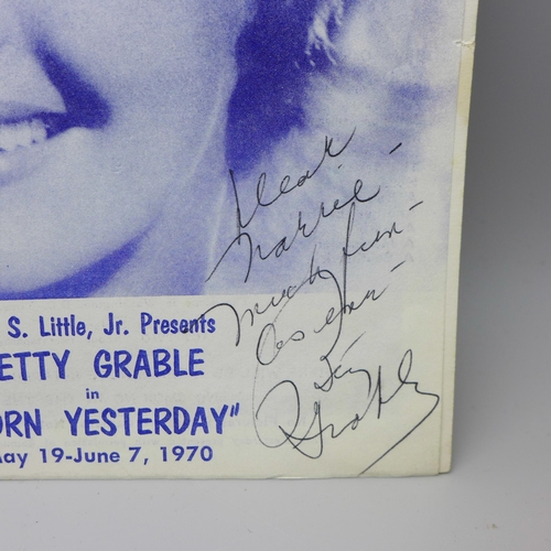 629 - A Betty Grable autographed magazine, 1970 and an autographed black and white photograph of Doris Day