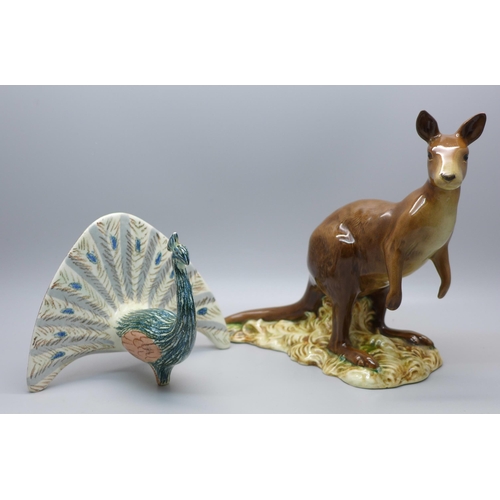 634 - A Beswick Kangaroo (ear restored) and a Beswick Peacock (neck a/f)