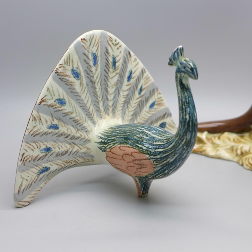 634 - A Beswick Kangaroo (ear restored) and a Beswick Peacock (neck a/f)