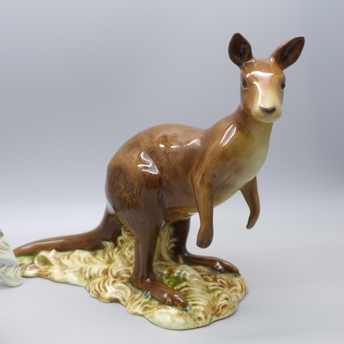 634 - A Beswick Kangaroo (ear restored) and a Beswick Peacock (neck a/f)