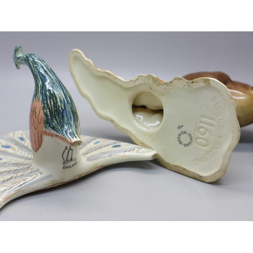 634 - A Beswick Kangaroo (ear restored) and a Beswick Peacock (neck a/f)