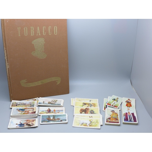 636 - A collection of cigarette cards and a History of Players book