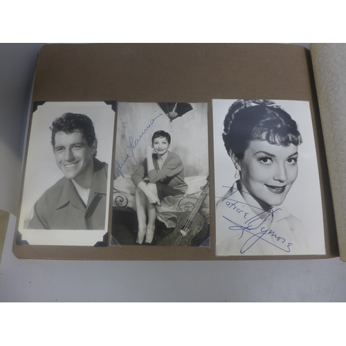 656 - Two albums of 1940s and 1950s movie star and celebrity signed photographs, real and facsimile, one a... 