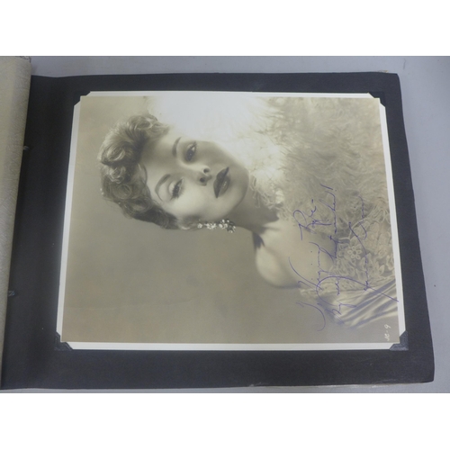 656 - Two albums of 1940s and 1950s movie star and celebrity signed photographs, real and facsimile, one a... 