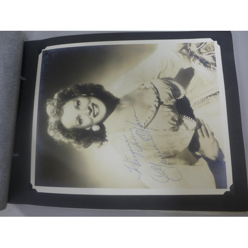 656 - Two albums of 1940s and 1950s movie star and celebrity signed photographs, real and facsimile, one a... 