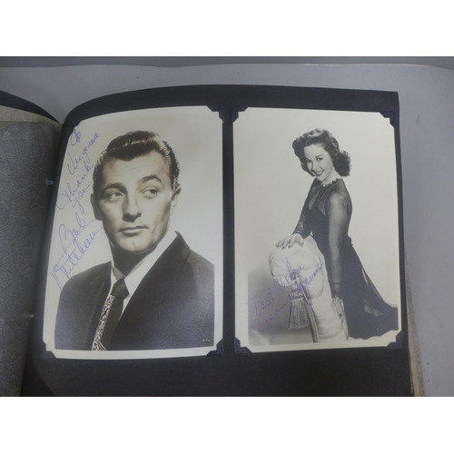 656 - Two albums of 1940s and 1950s movie star and celebrity signed photographs, real and facsimile, one a... 