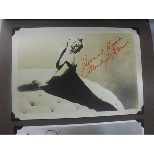 656 - Two albums of 1940s and 1950s movie star and celebrity signed photographs, real and facsimile, one a... 