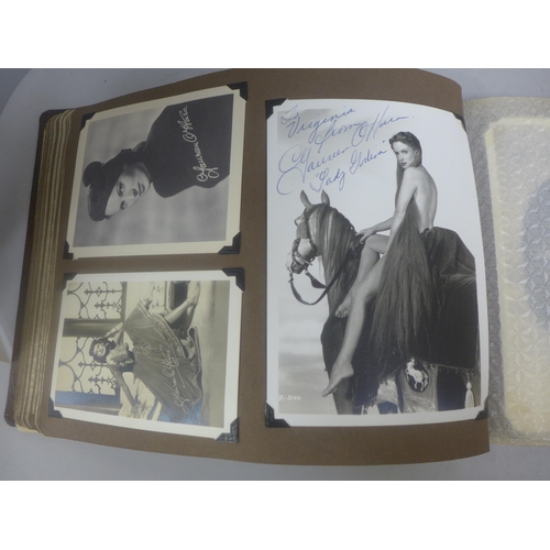 656 - Two albums of 1940s and 1950s movie star and celebrity signed photographs, real and facsimile, one a... 