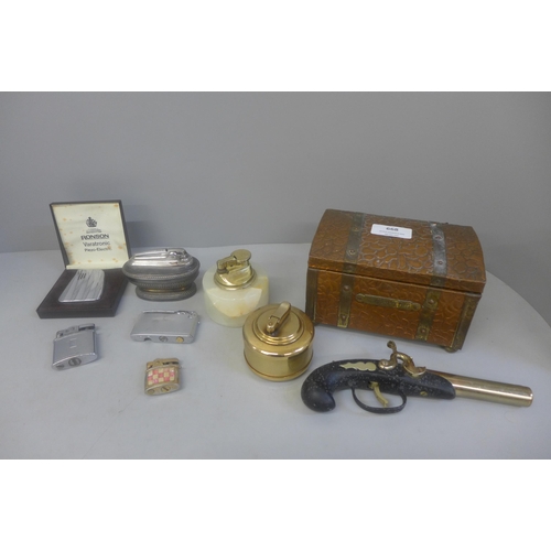 668 - Assorted items including table lighters, cigarette lighters, a cigarette box, etc.