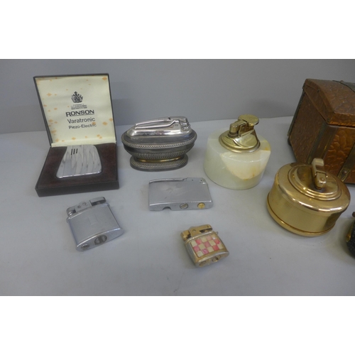 668 - Assorted items including table lighters, cigarette lighters, a cigarette box, etc.