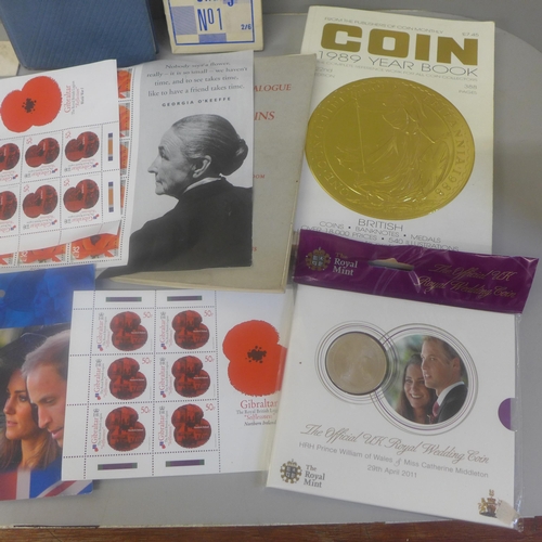 686 - A collection of coins and stamps and three books