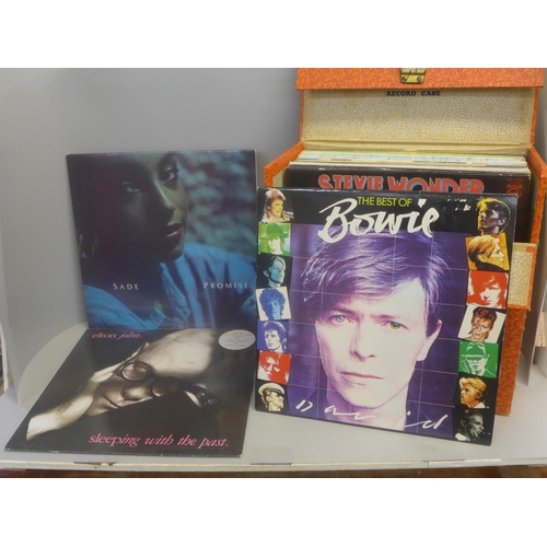 736 - Thirty LP records in a carry case, including David Bowie, Stevie Wonder, Police, Michael Jackson, Sa... 