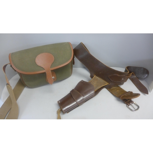 746 - A Rottweil leather and canvas gun cartridge bag and leather gun belt