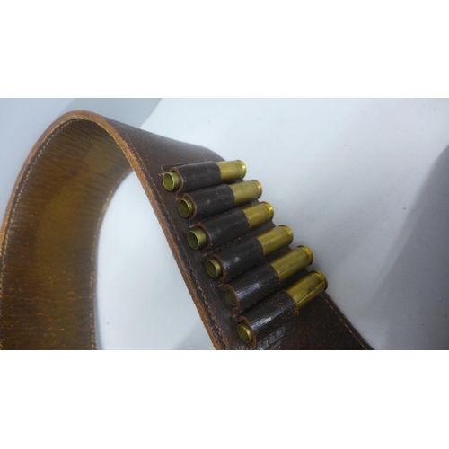 746 - A Rottweil leather and canvas gun cartridge bag and leather gun belt