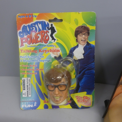 761 - An Action Man alarm clock, an Ozzy Talkin' Heads figure and an Austin Powers talking key chain