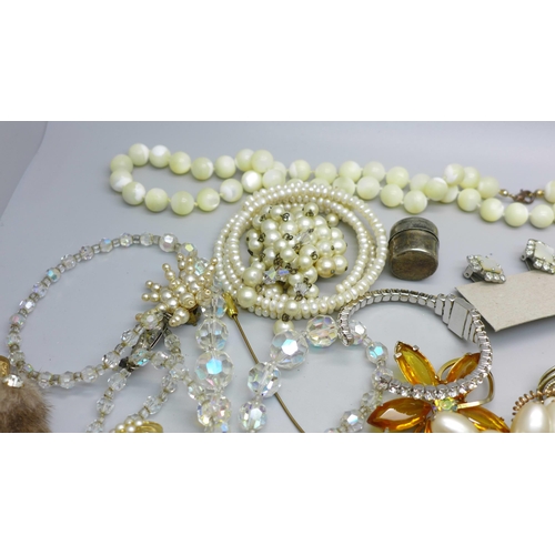 851 - Costume jewellery, hat pins, a Stratton compact, etc.