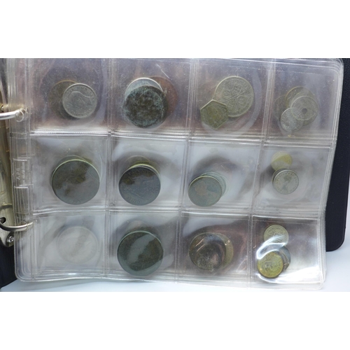 865 - An album of assorted coins including a Victorian shilling