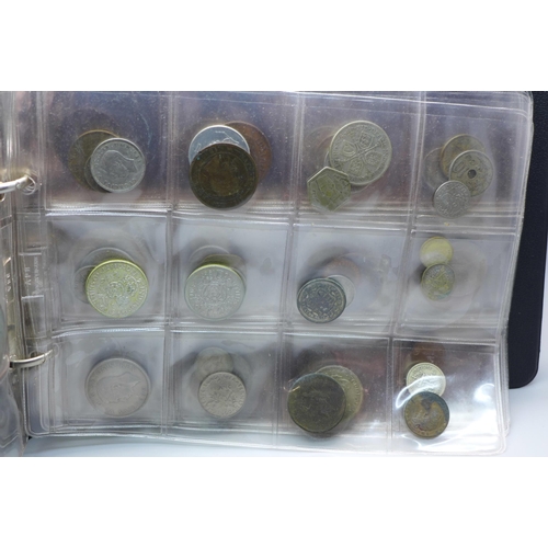 865 - An album of assorted coins including a Victorian shilling