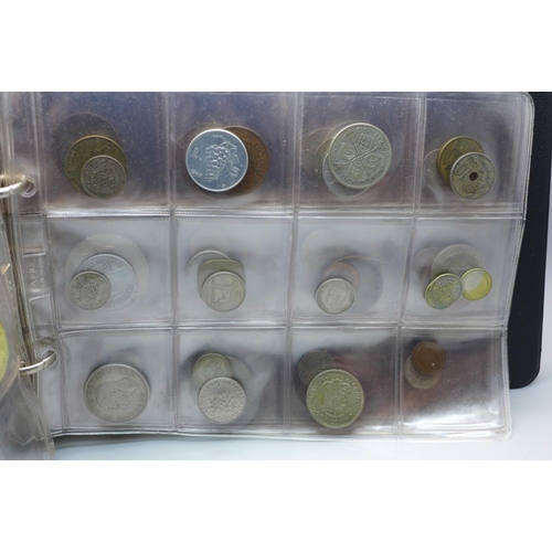 865 - An album of assorted coins including a Victorian shilling