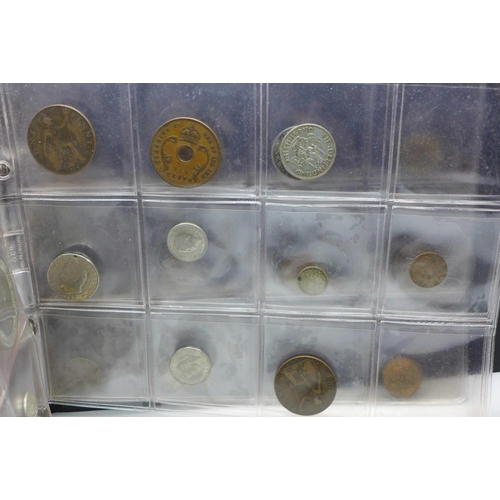 865 - An album of assorted coins including a Victorian shilling