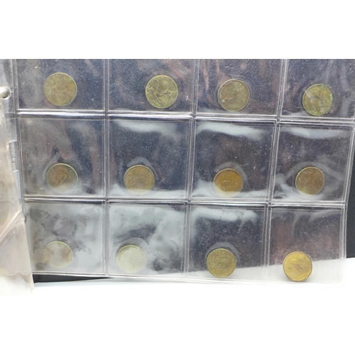 865 - An album of assorted coins including a Victorian shilling