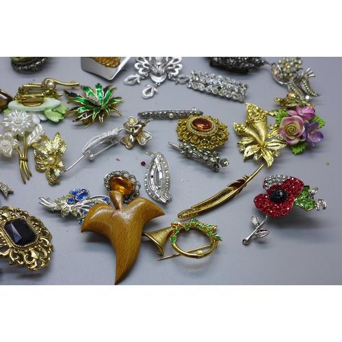 866 - Fifty-six costume brooches