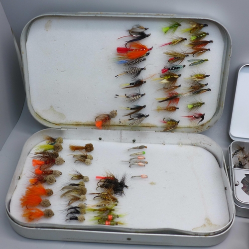 888A - A collection of fishing flies, (2 tins), and rod clips
