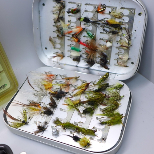 888A - A collection of fishing flies, (2 tins), and rod clips