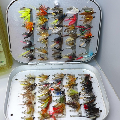 888A - A collection of fishing flies, (2 tins), and rod clips